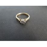 A 9ct yellow gold diamond solitaire ring illusion set, size I, approx 1.