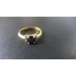 An 18ct Yellow Gold Sapphire and Diamond Ring - Size L - approximately 3 grams,