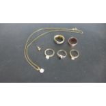 A quantity of 9ct Yellow Gold jewellery items to include a wedding band, three solitaire rings,
