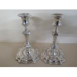 A pair of silver hallmarked candlesticks, approx 19 cm high,