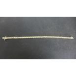 Gold mounted diamond set line bracelet - presumed 9ct gold, 5.