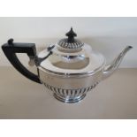 A silver teapot, approx 14 troy oz, hallmarks rubbed,