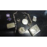 A Silver Cigarette Case, a Silver Vesta, a Silver Compact, a Silver Watch and two Fobs,