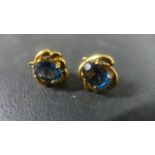 A pair of 9ct Yellow Gold Blue Topaz and Diamond Earrings - approximately 3 grams - in good