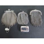 Three chain mail purses - one hallmarked Birmingham 1859 and a silver vesta hallmarked Birmingham
