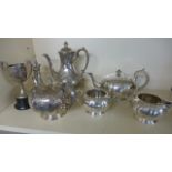 A small selection of plated ware including a three piece teaset