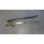 A 19th Century French bayonet with metal scabbard, dated Novembre 1874, 58 cm blade,