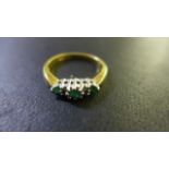 An 18ct yellow gold diamond and emerald ring - size N - approx 4 grams - generally good condition -