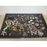 A large selection of costume jewellery - items include cameo brooches, rings,