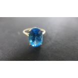 A 9ct gold blue topaz ring - size S - approximately 1.