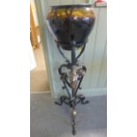 A Landscape Glazed Jardiniere on a metal stand of foliate design - 27 cm diameter - standing 103 cm