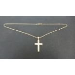 An 18ct Yellow Gold Crucifix set with seventeen diamonds on an 18ct Yellow Gold Chain,
