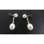 A pair of 9ct White Gold Pearl and Diamond Earrings - 25 mm drop - in good condition