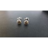 A pair of 18ct White Gold Single Stone Diamond earrings - approximately 3 mm diameter - diamonds