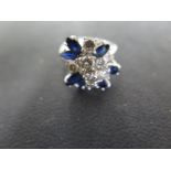 An 18ct White Gold Diamond and Sapphire Cluster Ring - Ring Size L - cluster is approx 15 mm x 15