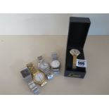 Five Quartz watches, all running in the saleroom,