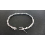 An 18ct white gold bracelet set with approx 2.96cts of diamonds, approx 11.