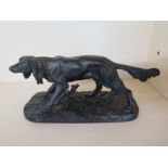 A cast iron bronzed figure of a dog - Length 30cm - good condition
