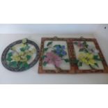 Three Oriental design frames with coloured interpretations of flowers to each - some losses but