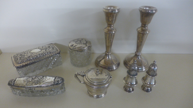 A pair of Silver Hallmarked Candlesticks, a pair of Peppers, a Mustard with blue glass liner,