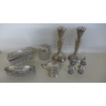 A pair of Silver Hallmarked Candlesticks, a pair of Peppers, a Mustard with blue glass liner,