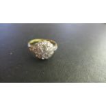 An 18ct Yellow Gold Diamond Cluster Ring - size Q - approximately 2.