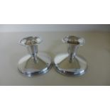 A pair of silver dwarf candlesticks - 6.