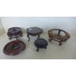 Five Oriental Hardwood Stands - largest 9 cm x 20 cm - all appear good,