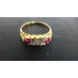 An 18ct Yellow Gold Ruby and Diamond Gypsy Ring, five diamonds approx 0.