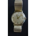 A 9ct Yellow Gold Manual Wind Gents Wristwatch - the dial signed Asprey - 35 mm wide including
