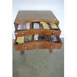 A walnut cabinet of "Community" cutlery - 119 pieces - 12 place setting, carving set,