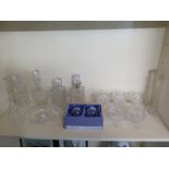 A quantity of cut glass items including four decanters, one with silver collar,