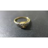 An 18ct yellow gold diamond ring - the central diamond approx 0.