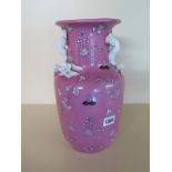 A 20th Century Porcelain Vase with White Moulded Prunus Handle and decorated in a Pink Ground -