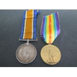 A 1914/18 War Medal and a World War One Victory Medal awarded to 2. Lieut E.B. Hill 5th Essex Regt.