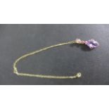 A 9ct Gold Amethyst Diamond and Ruby Pendant on a 40 cm chain - pendant is 3 cm long - approximate