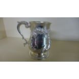 An Embossed Victorian Silver Tankard - London 1871/72 - maker Henry Holland - 13 cm tall - good