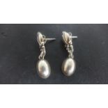 A pair of Georg Jensen silver earrings of egg shape form - some very light usage wear and scratches