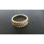 A Gold Rope Twist Ring - Size R - tests to approximately 18ct - approximately 9 grams - not