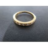 An 18ct Gold Modern Diamond Half Eternity Ring, 9 stones, round brilliant, Colour G/H,