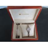 A ladies Citizen Quartz bracelet wristwatch with matching bracelet and spare links - boxed and good