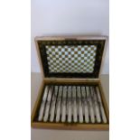 A Victorian Boxed Set of 12 plated knives and forks with Mother of Pearl Handles - some plate wear