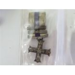 A miniature military cross awarded to Stewart Robert Bell,