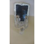 A cut glass perfume bottle with silver top,