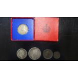 Four Georgian coins and a George VI commemorative coin