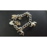 A silver charm bracelet, approx 1.