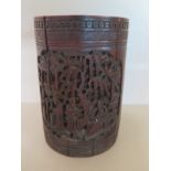 A Chinese carved hardwood brush pot with panels depicting animals and figures in landscape - 17.