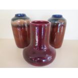 A pair of 20th Century ceramic vases - blue and brown glazed and one other with deep mauve glaze -