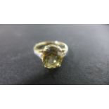 A 9ct Gold Citrine type ring with small diamonds - Size N, approximately 3.
