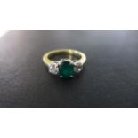 An 18ct Gold Emerald and Diamond 3 stone ring - size O,